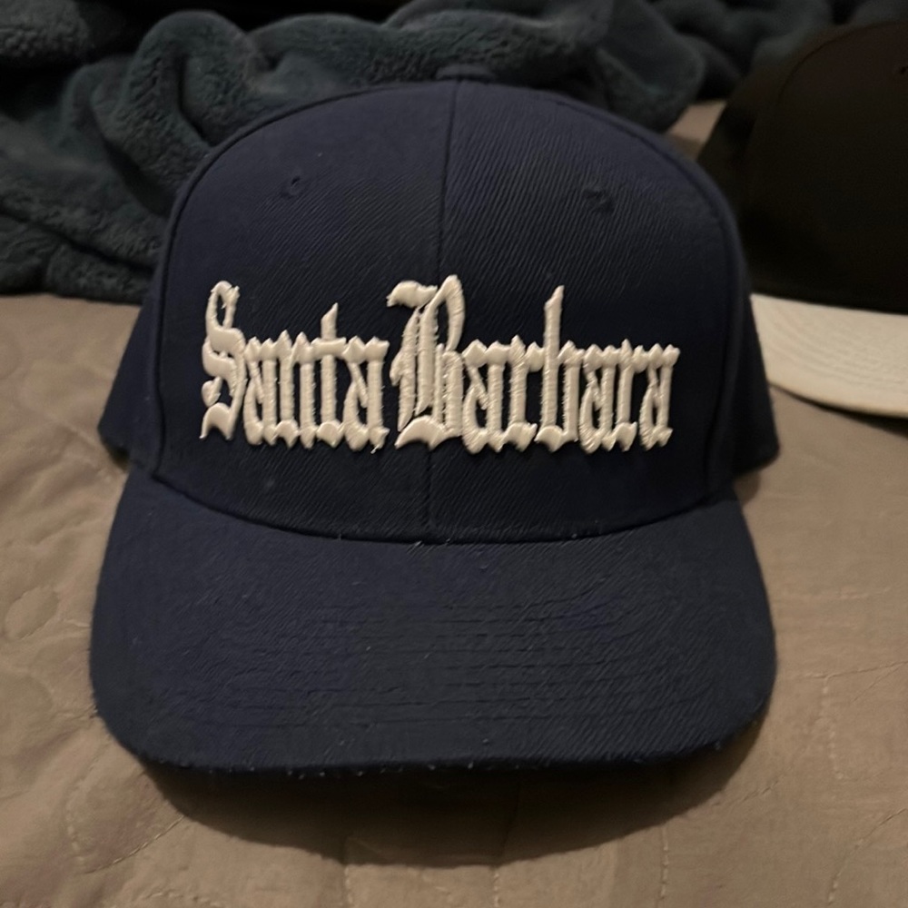 Im selling a hat, it’s says Santa Barbara in the front of it. It’s navy blue!